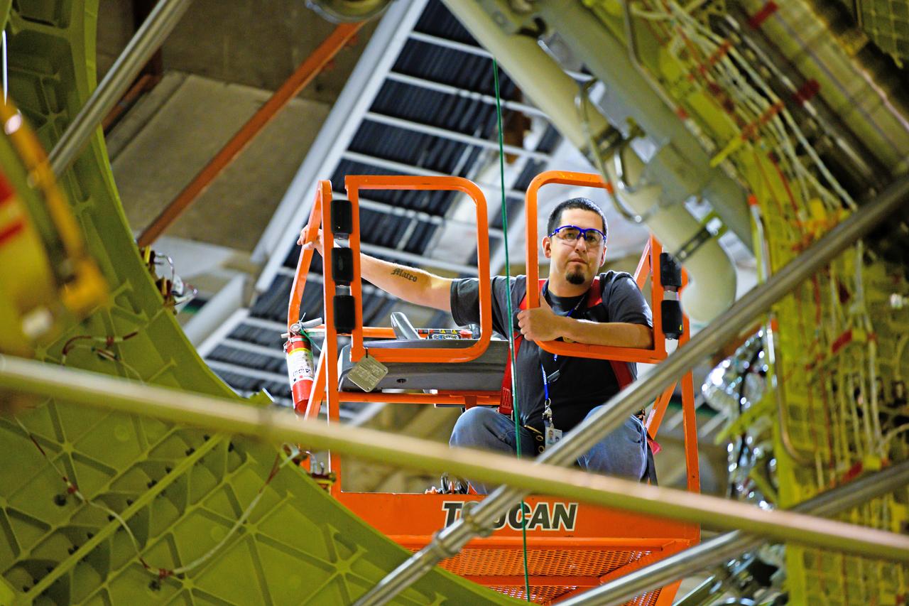 NASA finished assembling and joining the main structural components for the largest rocket stage the agency has built since the Saturn V that sent Apollo astronauts to the Moon. Engineers at the agency’s Michoud Assembly Facility in New Orleans connected the last of the five sections of the Space Launch System (SLS) rocket core stage Sept. 19. The stage will produce 2 million pounds of thrust to send Artemis I, the first flight SLS and NASA’s Orion spacecraft to the Moon. The engine section is located at the bottom of the 212-foot-tall stage and houses the four RS-25 engines. The core stage’s two liquid propellant tanks and four RS-25 engines will produce more than 2 million pounds of thrust to send the SLS rocket and Orion on the Artemis lunar missions. The engine section houses the four RS-25 engines and includes vital systems for mounting, controlling and delivering fuel form the propellant tanks to the rocket’s engines.  Offering more payload mass, volume capability and energy to speed missions through space, the SLS rocket, along with NASA’s Gateway in lunar orbit and Orion, is part of NASA’s backbone for deep space exploration and the Artemis lunar program. No other rocket is capable of carrying astronauts in Orion around the Moon in a single mission.